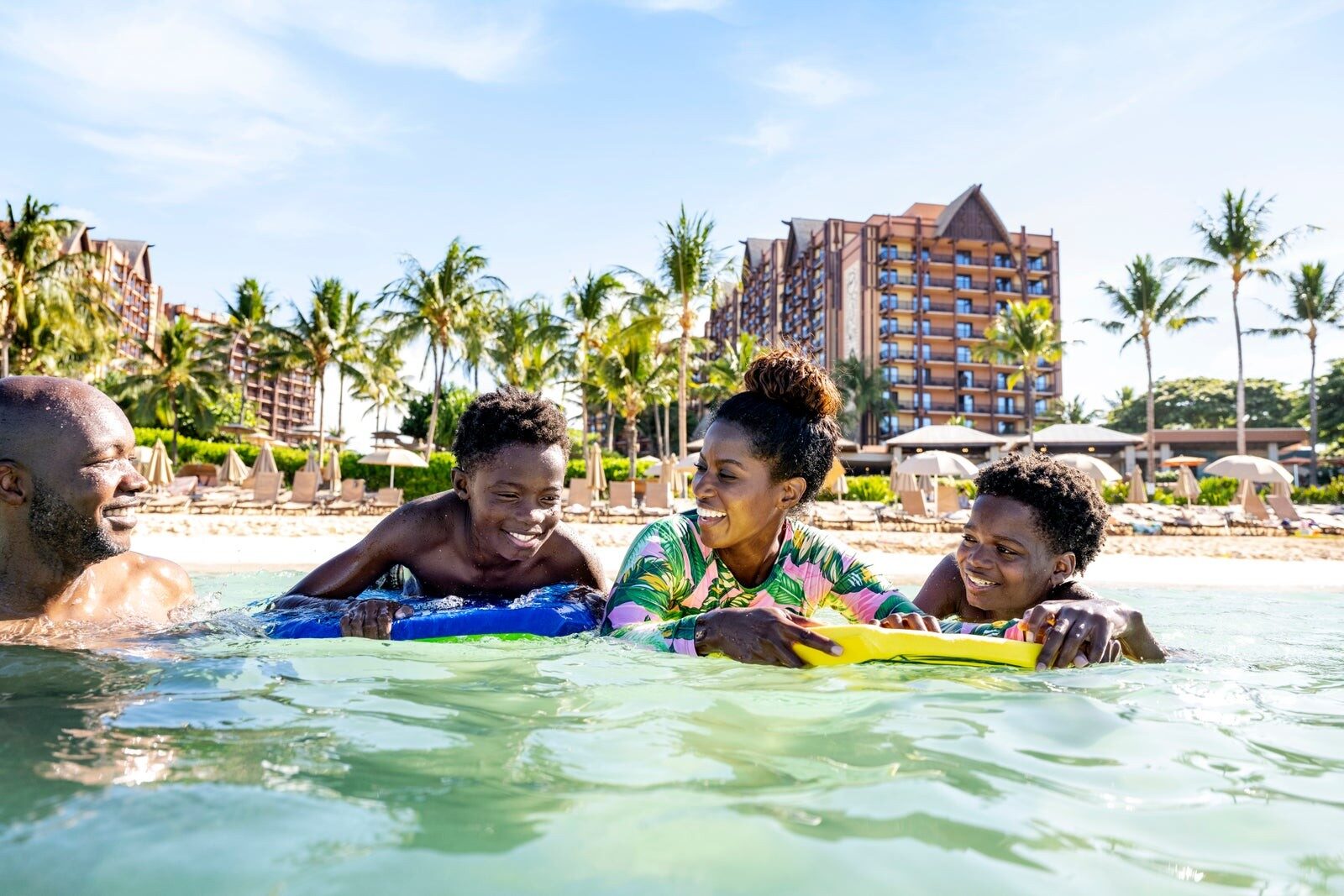 A family on the beach at Aulani, A Disney Resort & Spa, Ko Olina on the island of Oahu