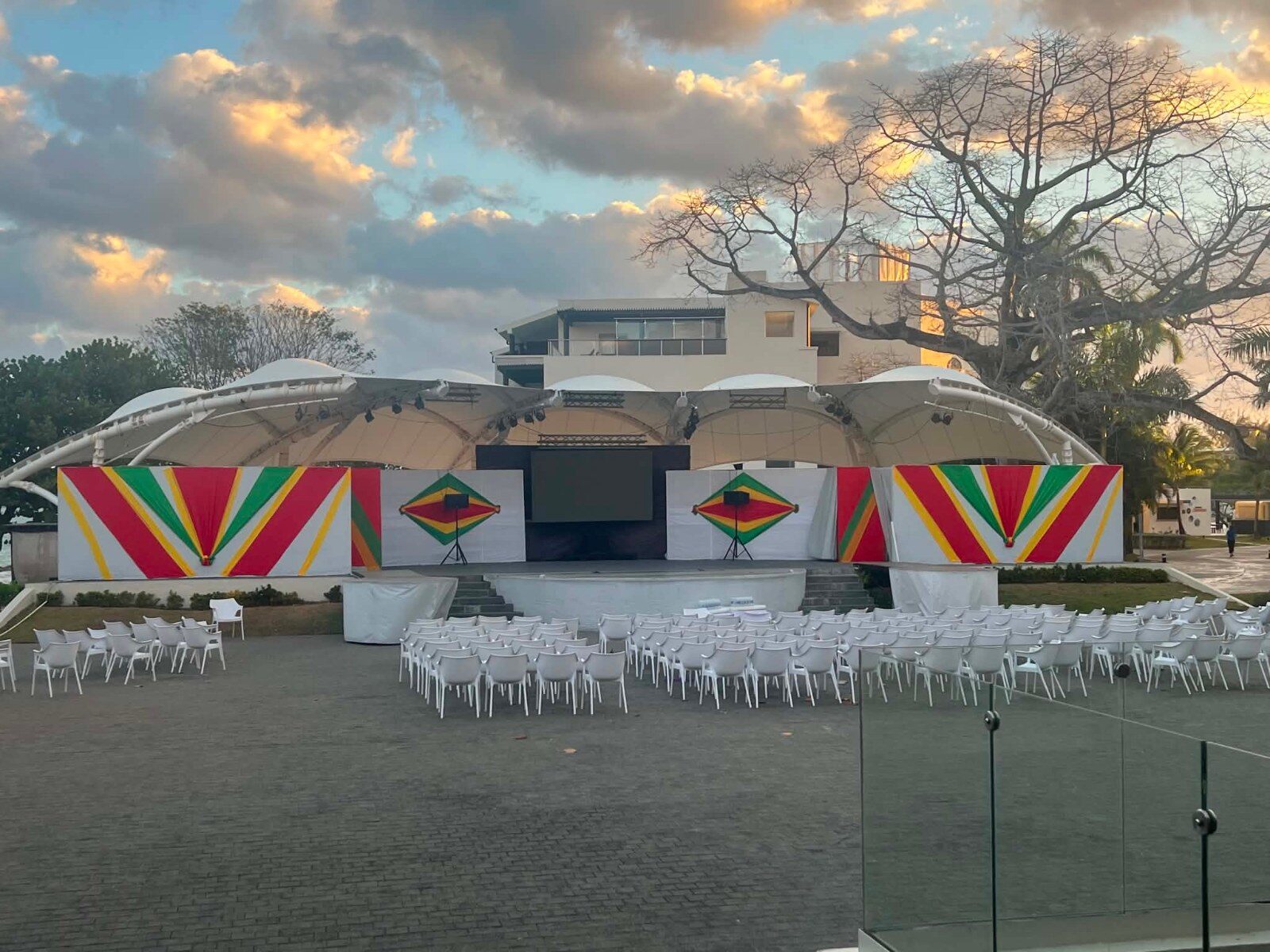 Event stage facing the sea at sunset before participants arrive