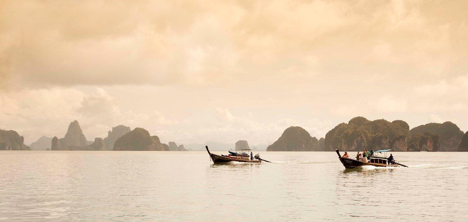 Longtail boats in a bay in Thailand Longtail boats in a bay in Thailand