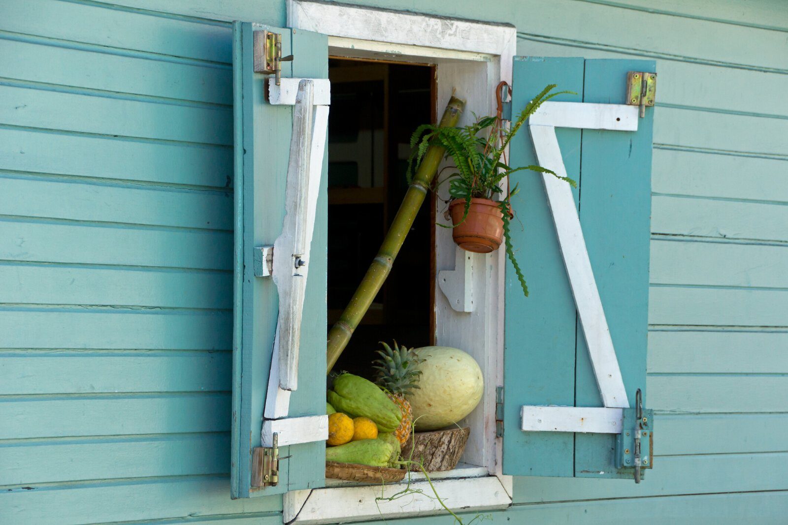 Window of a Creole house with colourful shutters