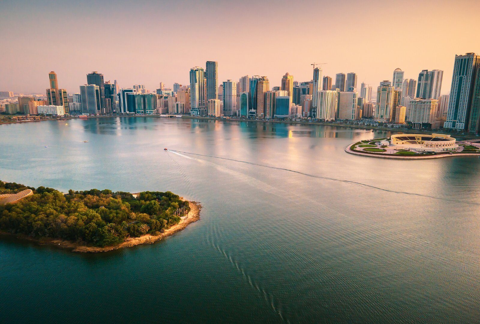 Dubai skyscrapers by the water at dawn
