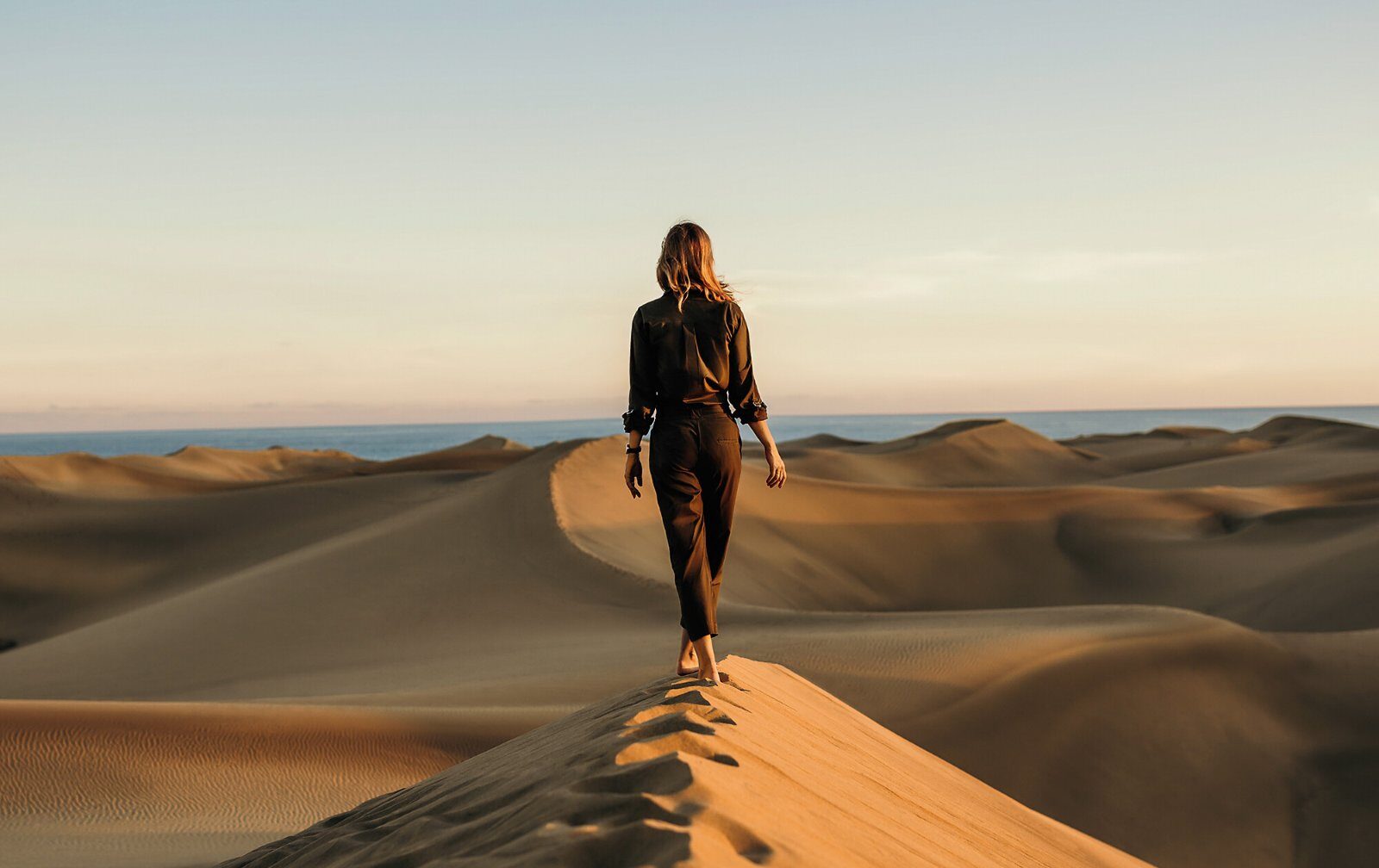 Walker on the dunes of the Moroccan desert