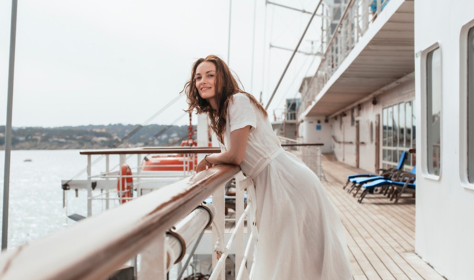 Passenger leaning on the rail of the Club Med 2 on the open sea