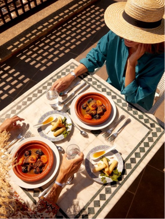 Table set with traditional Moroccan dishes at the Yasmina restaurant at Club Med Yasmina, offering an authentic feast.