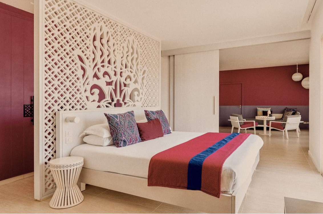 Elegant interior of the Sultana suite at Club Med Yasmina, featuring a spacious bedroom and a separate lounge area.