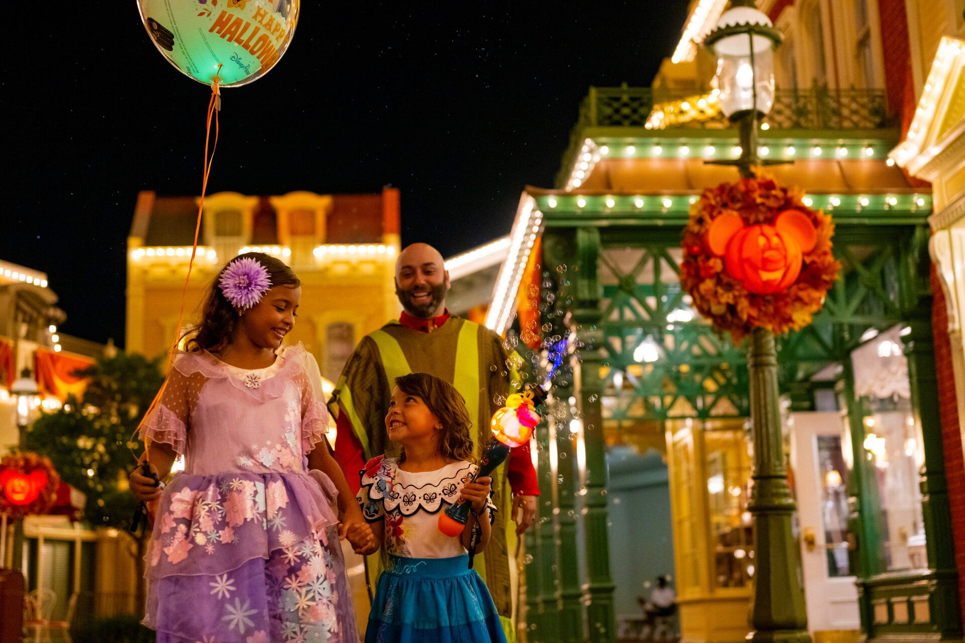 A family in costume on Main Street, U.S.A. during Mickey’s Not-So-Scary Halloween Party at Magic Kingdom A family in costume on Main Street, U.S.A. during Mickey’s Not-So-Scary Halloween Party at Magic Kingdom