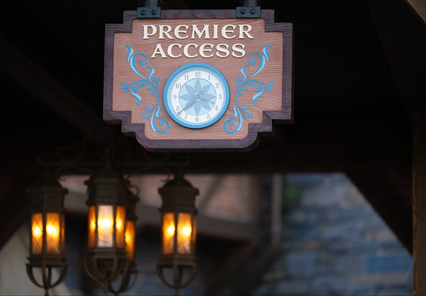 The wooden Premier Access sign, with its clock, at the entrance to an attraction queue at World of Frozen. Photo: ©Disney. The wooden Premier Access sign, with its clock, at the entrance to an attraction queue at World of Frozen. Photo: ©Disney.