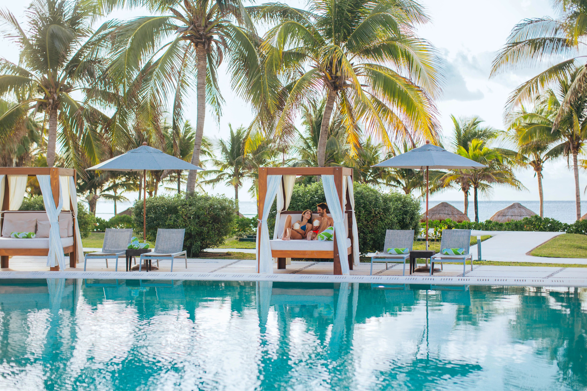 Pool with a cabana for couples at Dreams Puerto Morelos, Riviera Maya with Aquaterra Travels Pool with a cabana for couples at Dreams Puerto Morelos, Riviera Maya with Aquaterra Travels