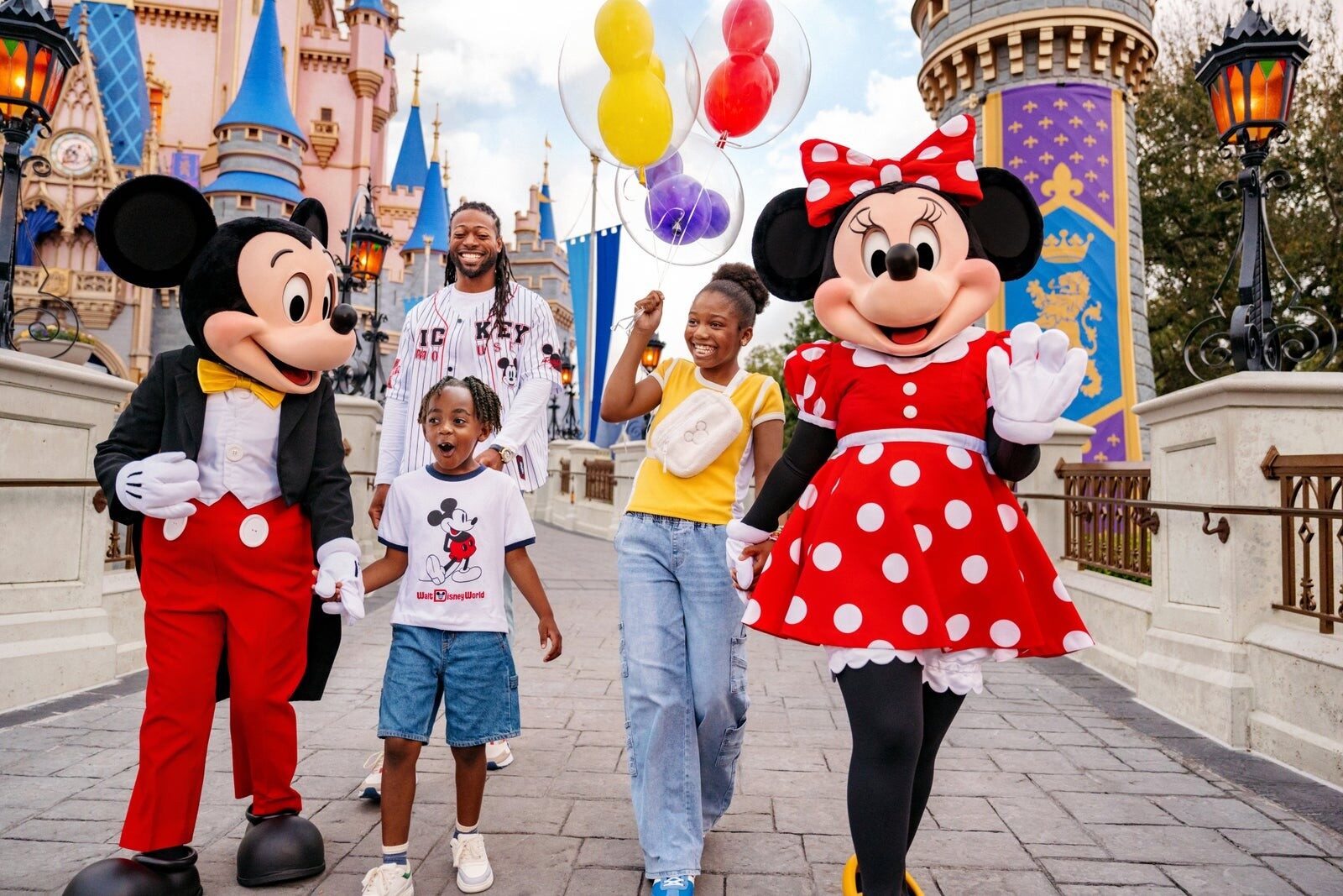 A family in front of Cinderella Castle at Magic Kingdom Park, Walt Disney World Resort in Florida A family in front of Cinderella Castle at Magic Kingdom Park, Walt Disney World Resort in Florida