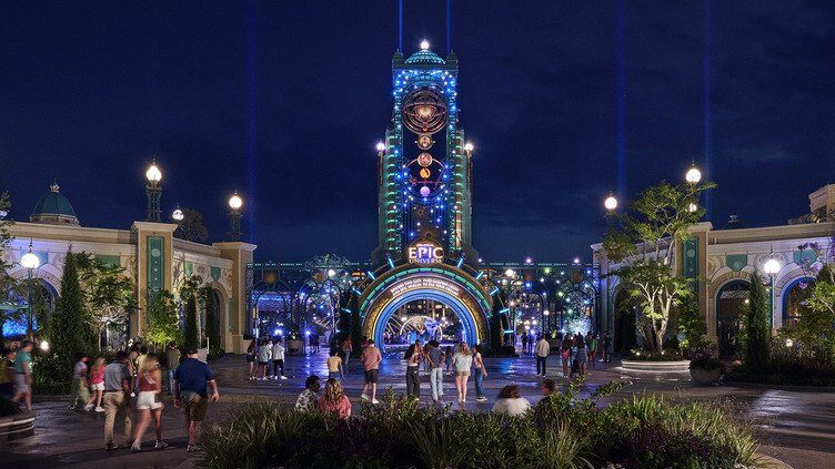 The entrance of Universal Epic Universe seen from a distance at night