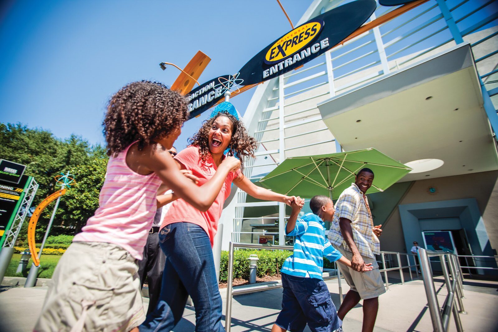 A family walks through the Universal Express entrance of an attraction at Universal Orlando Resort A family walks through the Universal Express entrance of an attraction at Universal Orlando Resort